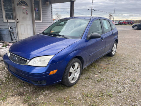2006 Ford Focus for sale at HEDGES USED CARS in Carleton MI