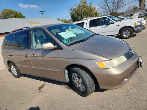 2003 Honda Odyssey for sale at COMMUNITY AUTO in Fresno CA
