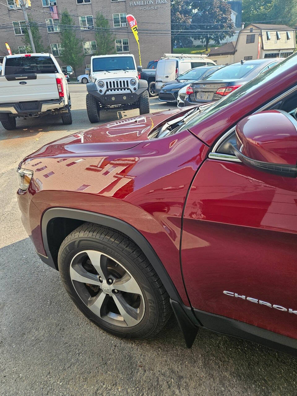 2019 Jeep Cherokee for sale at RENOS AUTO SALES LLC in Waterbury, CT