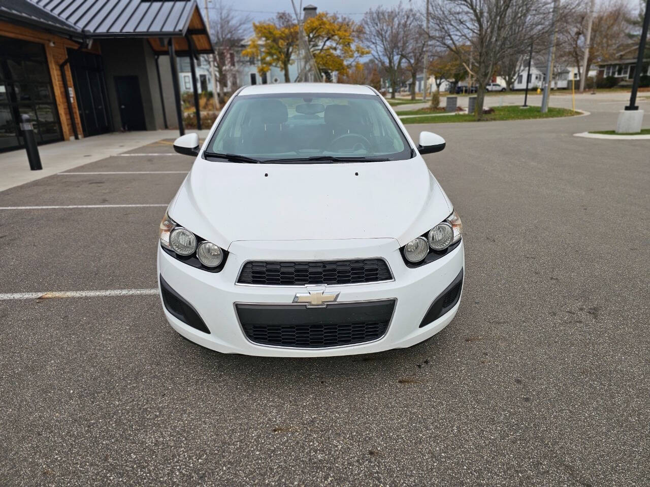 2014 Chevrolet Sonic for sale at WAGNER AUTO MART LLC in Ann Arbor, MI