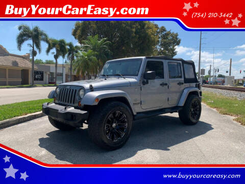 2013 Jeep Wrangler Unlimited for sale at BuyYourCarEasyllc.com in Hollywood FL
