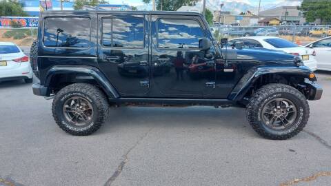 2016 Jeep Wrangler Unlimited for sale at CarSmart Auto Group in Murray UT