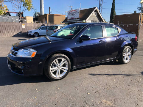 2011 Dodge Avenger for sale at C J Auto Sales in Riverbank CA