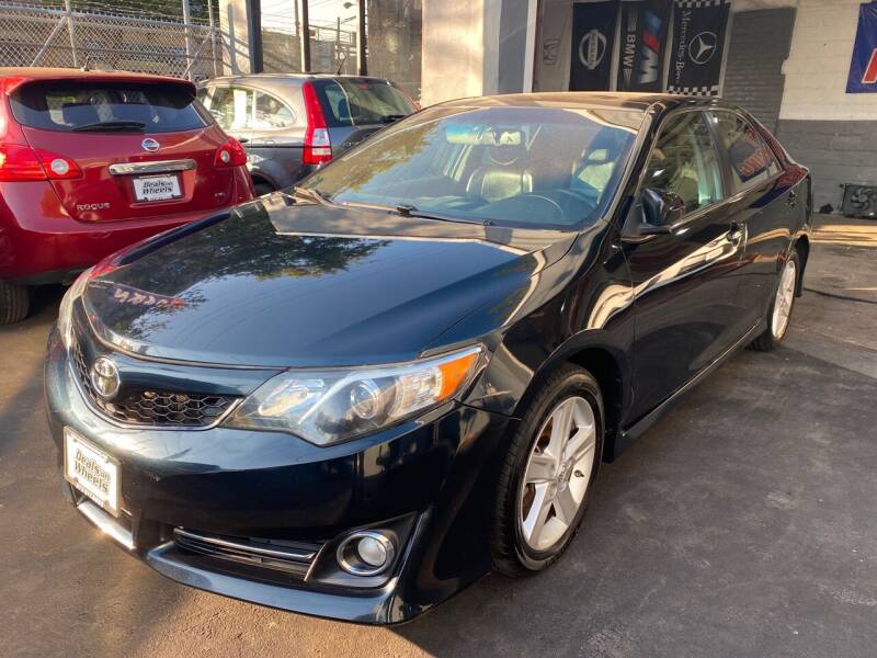 2014 Toyota Camry for sale at DEALS ON WHEELS in Newark NJ