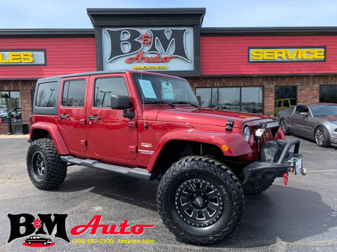 2012 Jeep Wrangler Unlimited for sale at B & M Auto Sales Inc. in Oak Forest IL