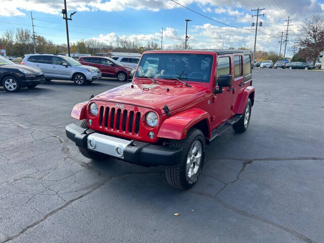 2014 Jeep Wrangler Unlimited for sale at Wyrick Auto Sales & Leasing Inc in Holland, MI