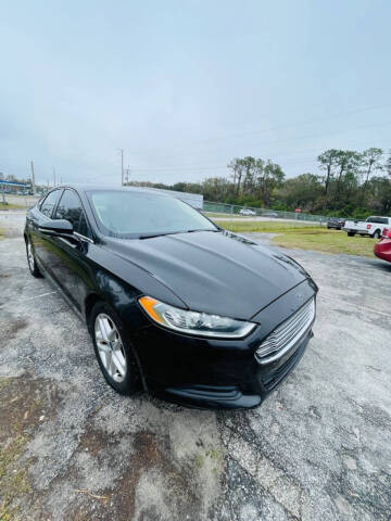 2013 Ford Fusion for sale at CARNUGO in Lakeland FL