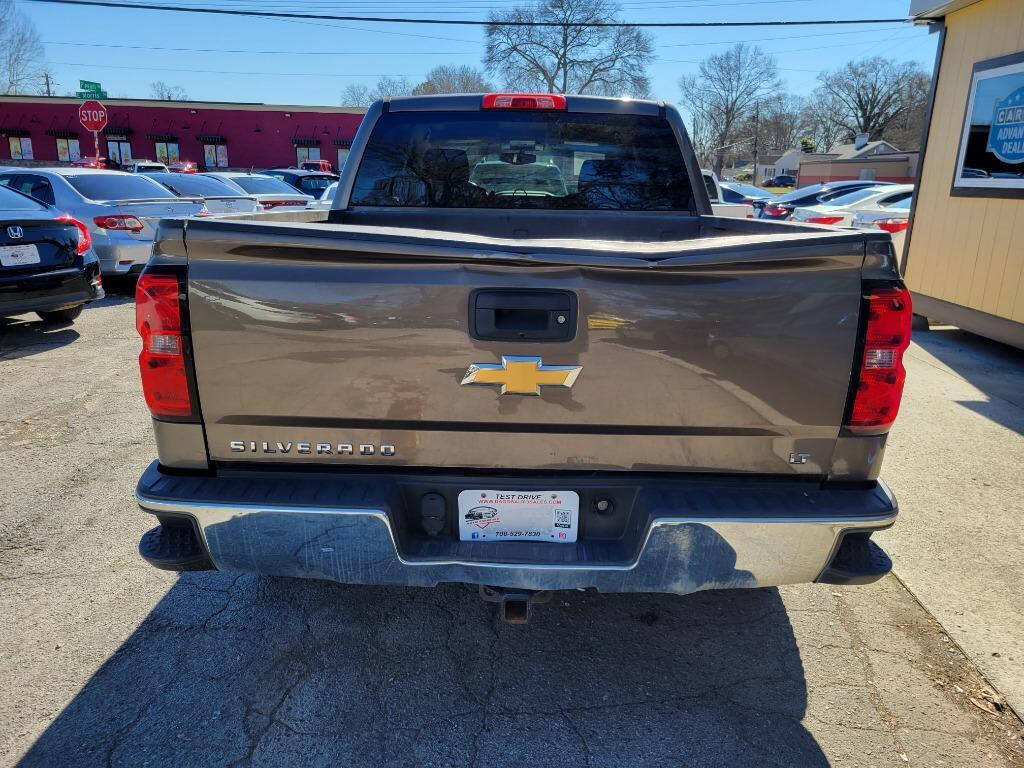 2014 Chevrolet Silverado 1500 for sale at DAGO'S AUTO SALES LLC in Dalton, GA