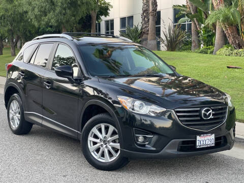 2016 Mazda CX-5 for sale at MILLENNIUM MOTORS in Van Nuys CA