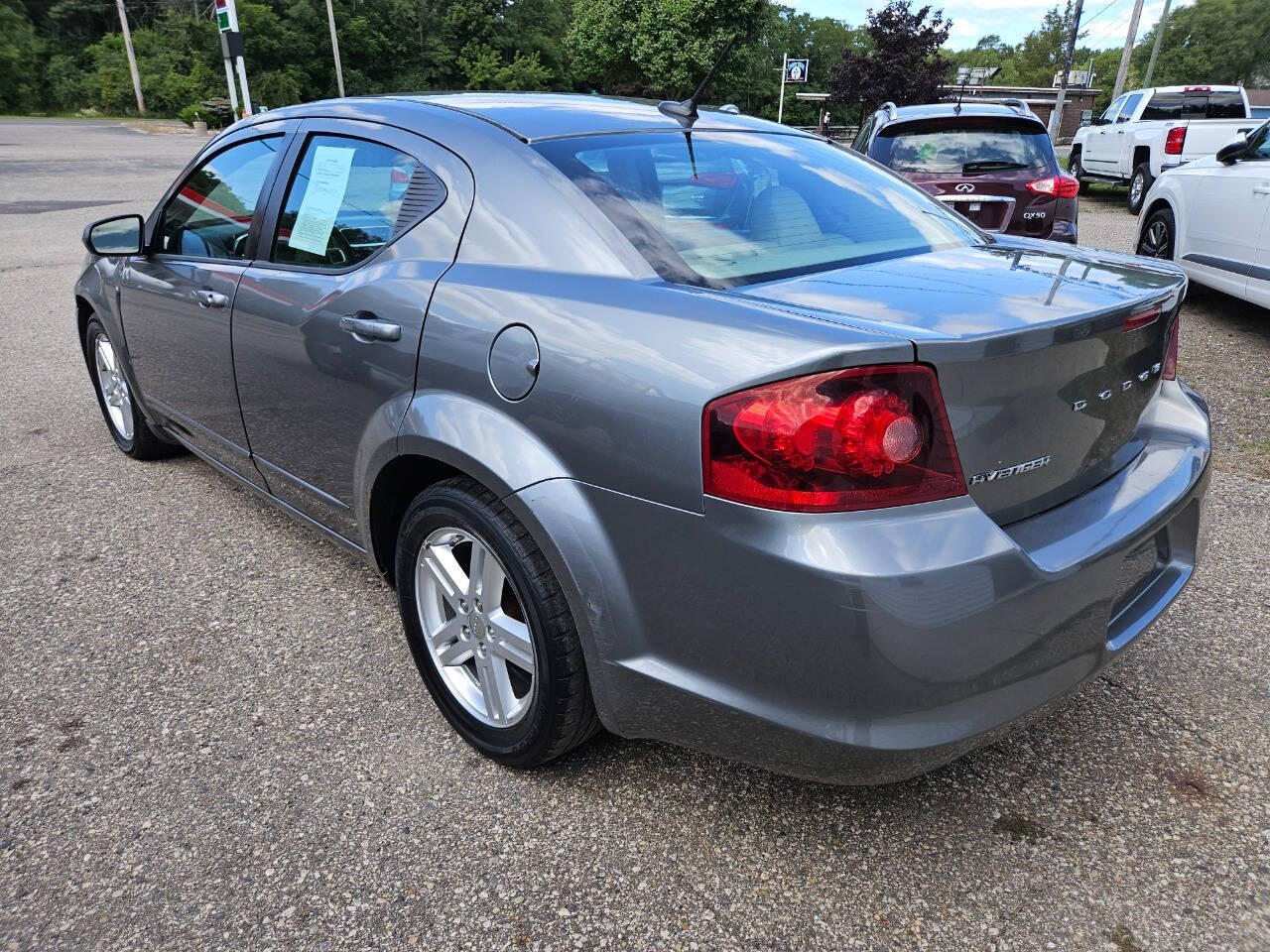 2013 Dodge Avenger for sale at DANGO AUTO SALES in HOWARD CITY, MI