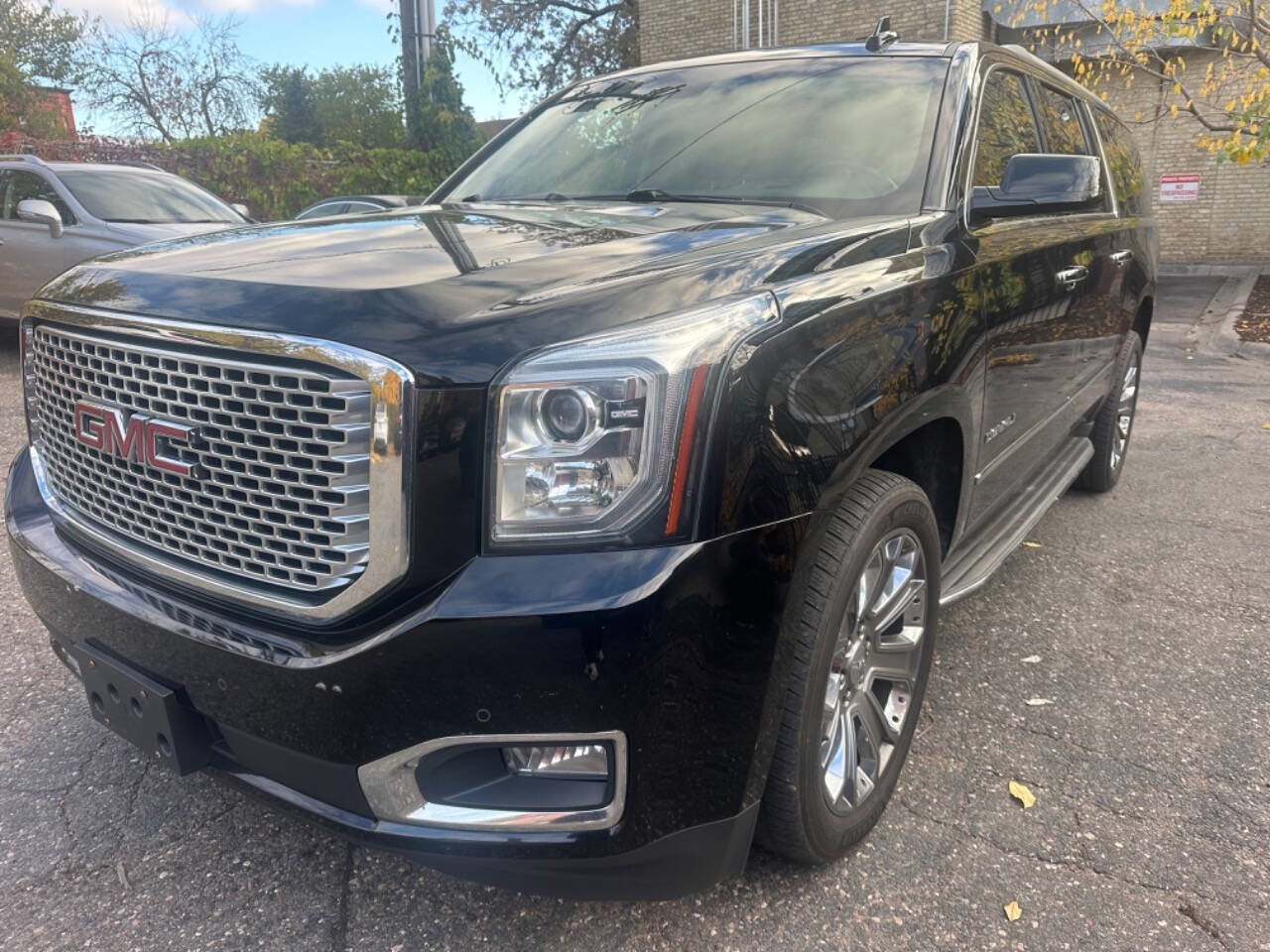 2015 GMC Yukon XL for sale at JUST AUTOS in MINNEAPOLIS, MN