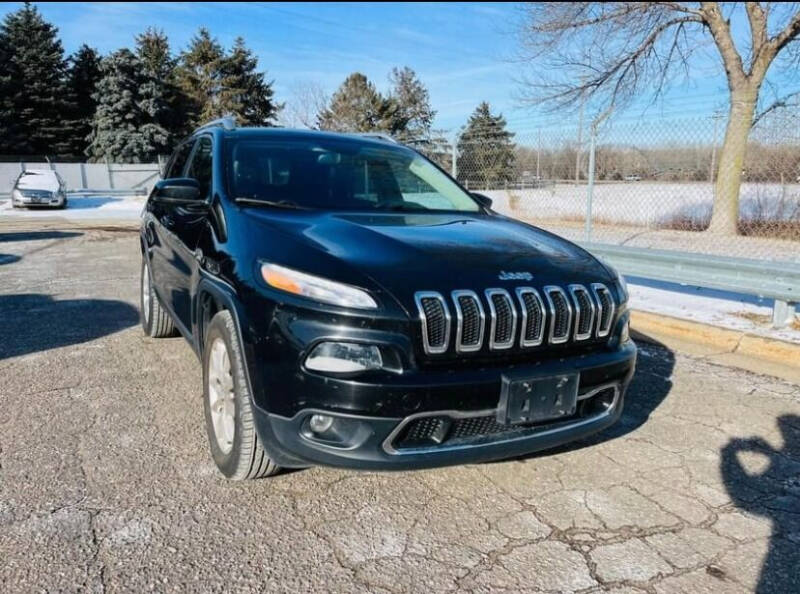 2015 Jeep Cherokee for sale at Rams Auto Sales LLC in South Saint Paul MN