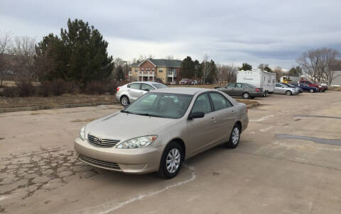 2005 Toyota Camry for sale at QUEST MOTORS in Englewood CO