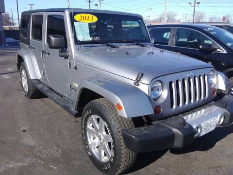 2013 Jeep Wrangler Unlimited for sale at Village Auto Outlet in Milan IL