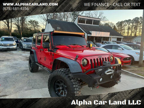 2009 Jeep Wrangler Unlimited for sale at Alpha Car Land LLC in Snellville GA
