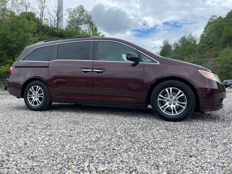 2011 Honda Odyssey for sale at Jim's Hometown Auto Sales LLC in Cambridge OH