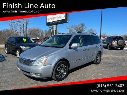 2011 Kia Sedona for sale at Finish Line Auto in Comstock Park MI