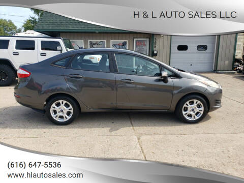 2015 Ford Fiesta for sale at H & L AUTO SALES LLC in Wyoming MI