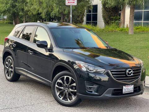 2016 Mazda CX-5 for sale at MILLENNIUM MOTORS in Van Nuys CA