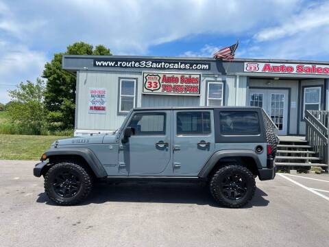 2015 Jeep Wrangler Unlimited for sale at Route 33 Auto Sales in Carroll OH