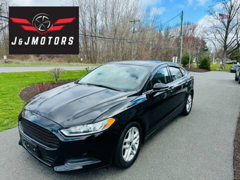 2016 Ford Fusion for sale at J & J MOTORS in New Milford CT