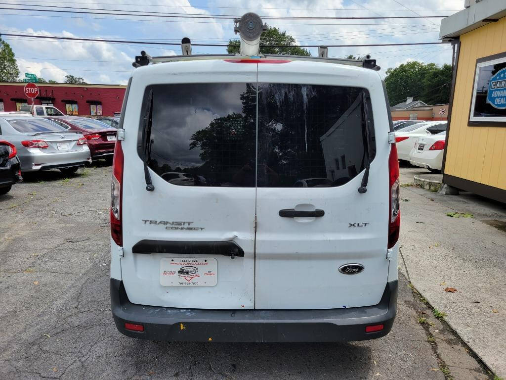 2016 Ford Transit Connect for sale at DAGO'S AUTO SALES LLC in Dalton, GA