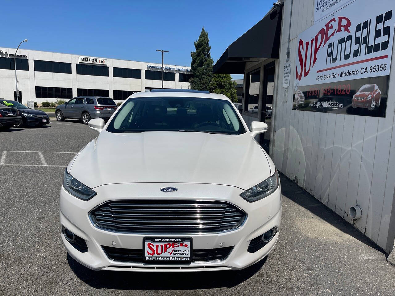 2014 Ford Fusion Hybrid for sale at Super Auto Sales Modesto in Modesto, CA