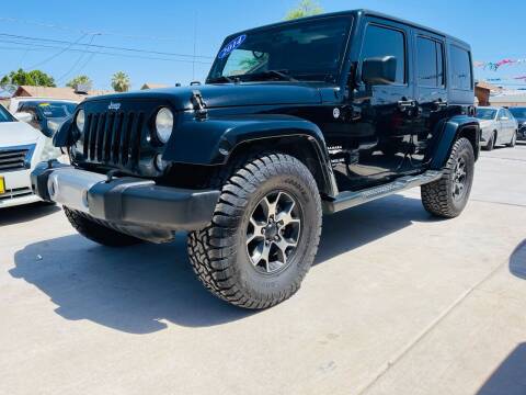 2014 Jeep Wrangler Unlimited for sale at A AND A AUTO SALES in Gadsden AZ