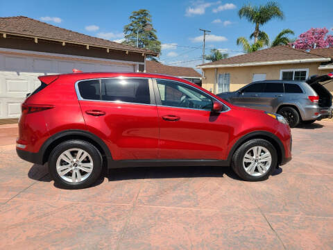 2017 Kia Sportage for sale at E and M Auto Sales in Bloomington CA