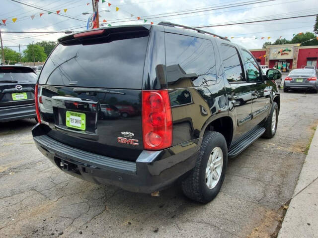 2008 GMC Yukon for sale at DAGO'S AUTO SALES LLC in Dalton, GA