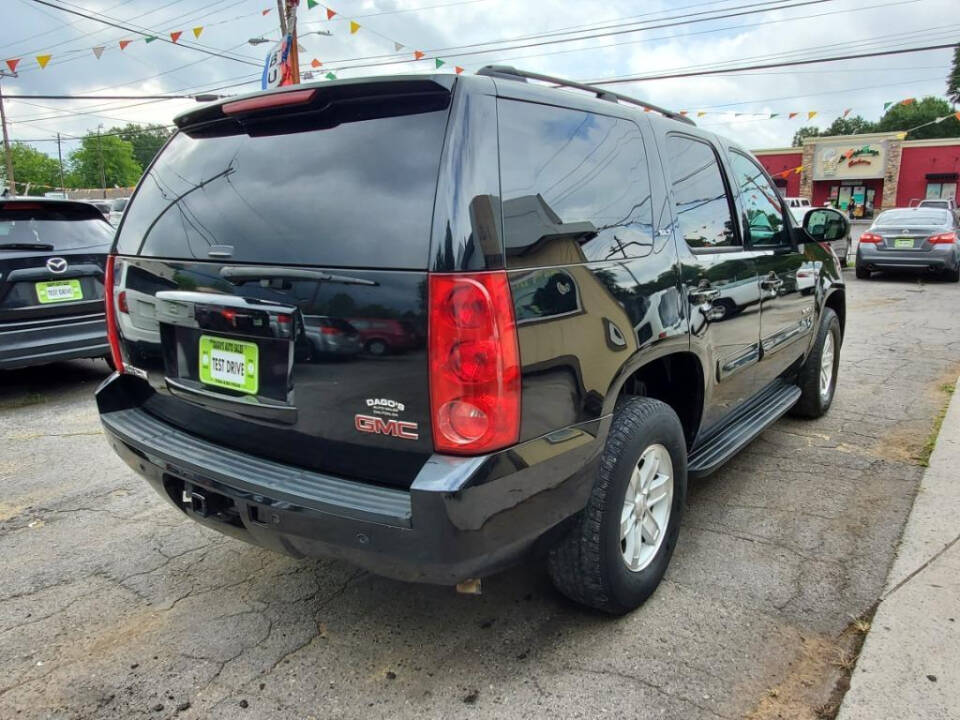 2008 GMC Yukon for sale at DAGO'S AUTO SALES LLC in Dalton, GA