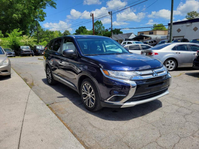 2016 Mitsubishi Outlander for sale at DAGO'S AUTO SALES LLC in Dalton, GA