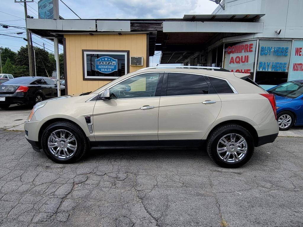 2011 Cadillac SRX for sale at DAGO'S AUTO SALES LLC in Dalton, GA