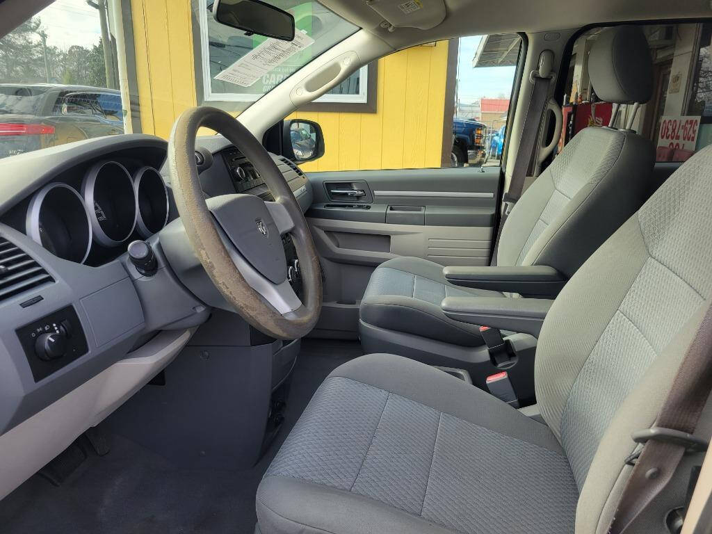 2010 Dodge Grand Caravan for sale at DAGO'S AUTO SALES LLC in Dalton, GA