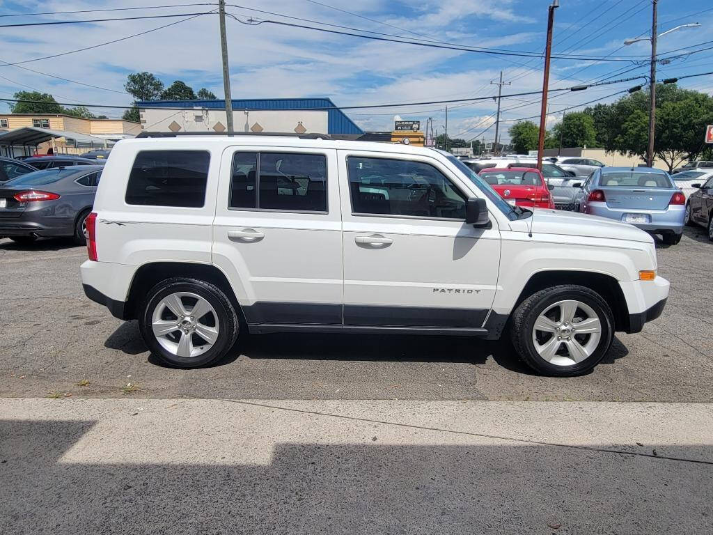 2014 Jeep Patriot for sale at DAGO'S AUTO SALES LLC in Dalton, GA