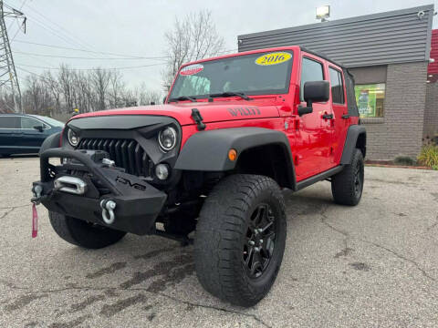 2016 Jeep Wrangler Unlimited for sale at George's Used Cars in Brownstown MI