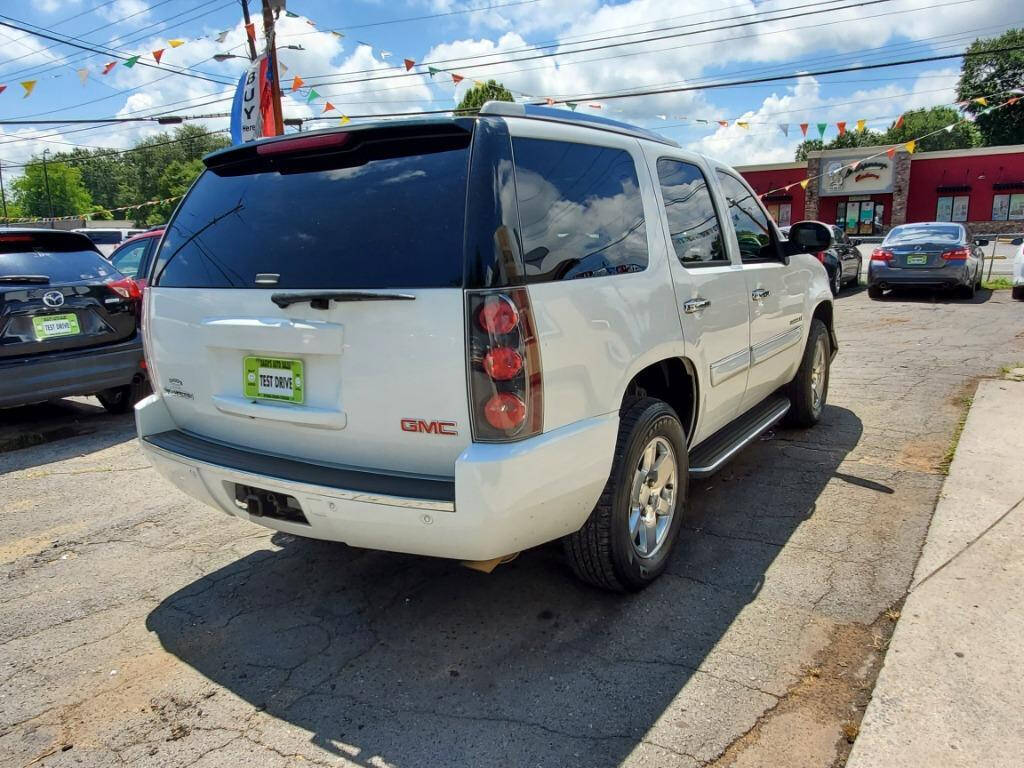 2007 GMC Yukon for sale at DAGO'S AUTO SALES LLC in Dalton, GA