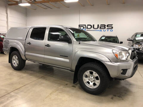 2015 Toyota Tacoma for sale at DUBS AUTO LLC in Clearfield UT