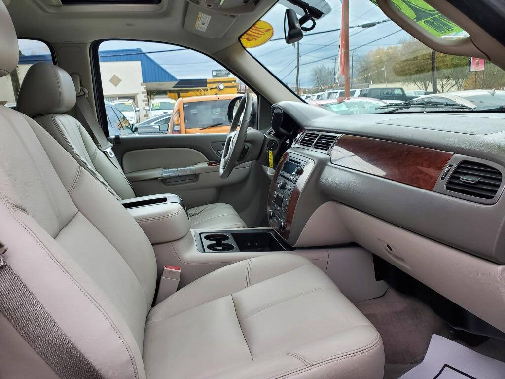 2013 Chevrolet Suburban for sale at DAGO'S AUTO SALES LLC in Dalton, GA