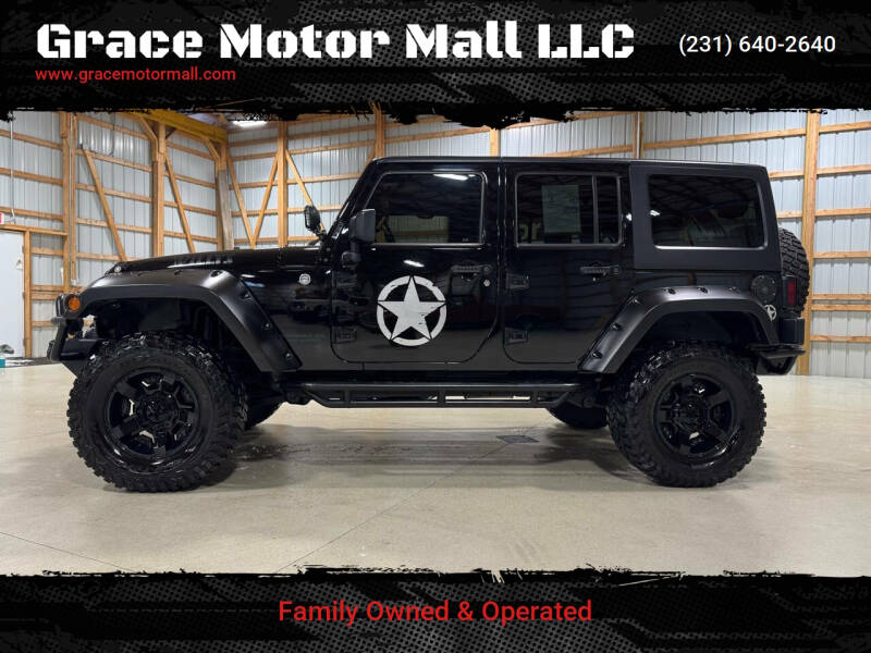 2015 Jeep Wrangler Unlimited for sale at Grace Motor Mall LLC in Traverse City MI