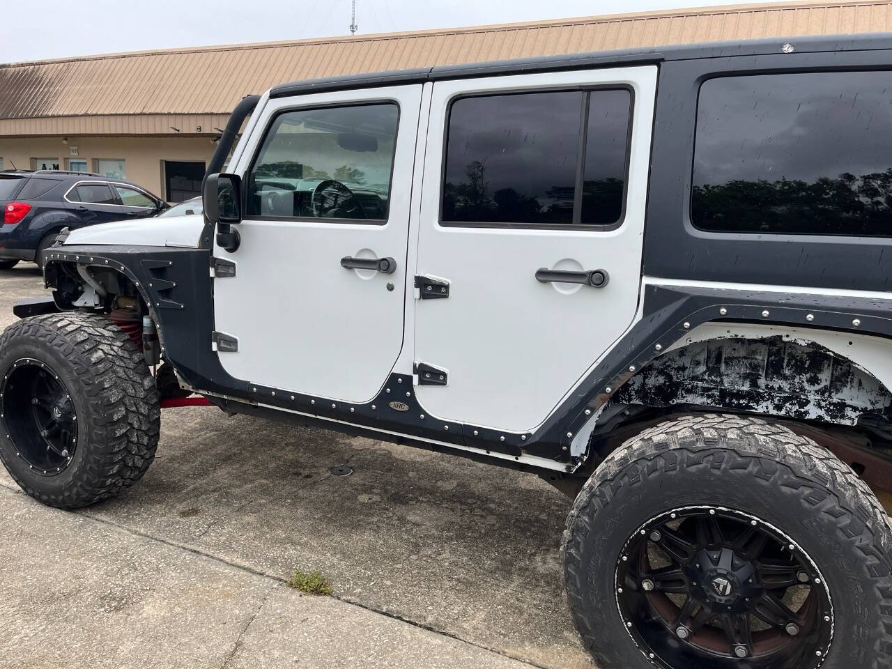 2013 Jeep Wrangler Unlimited for sale at Putnam Motors in Pomona Park, FL