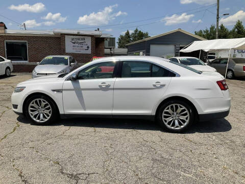 2014 Ford Taurus for sale at Autocom, LLC in Clayton NC