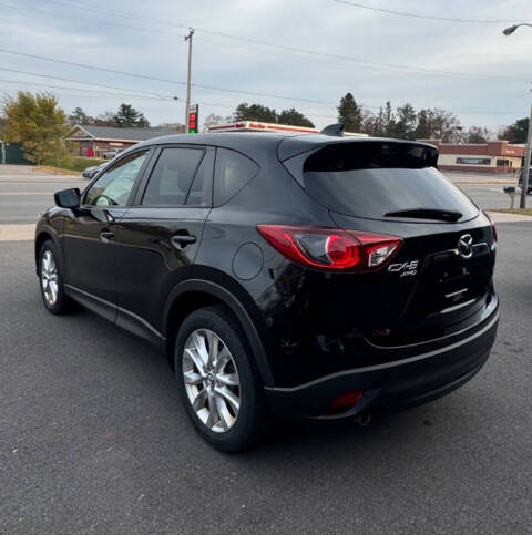 2015 Mazda CX-5 for sale at SIGNATURE AUTOS LLC in Weston, WI