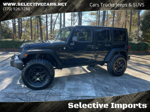 2015 Jeep Wrangler Unlimited for sale at Selective Imports in Woodstock GA