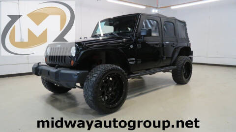 2011 Jeep Wrangler Unlimited for sale at Midway Auto Group in Addison TX