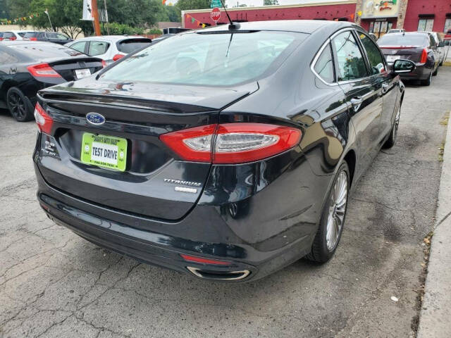 2016 Ford Fusion for sale at DAGO'S AUTO SALES LLC in Dalton, GA