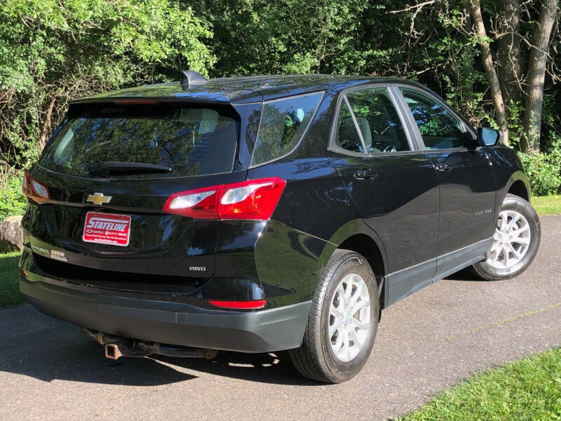 Used 2021 Chevrolet Equinox LS with VIN 2GNAXSEV4M6143909 for sale in Iron River, MI