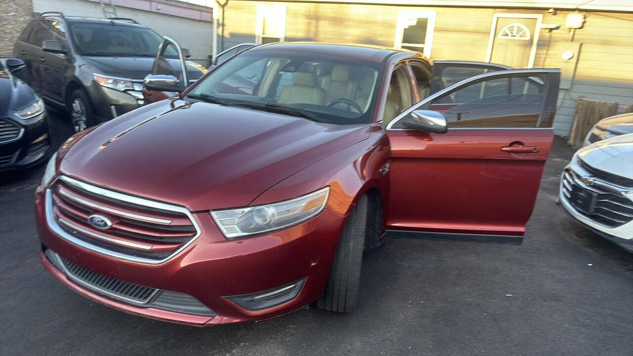 2014 Ford Taurus for sale at Ganda Auto Sales in Denver, CO