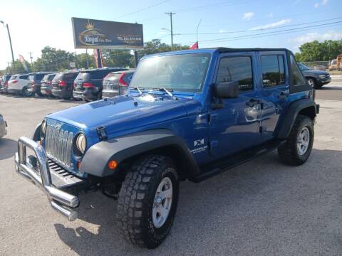 2009 Jeep Wrangler Unlimited for sale at ROYAL AUTO MART in Tampa FL