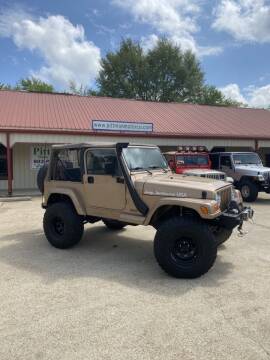 1999 Jeep Wrangler for sale at PITTMAN MOTOR CO in Lindale TX